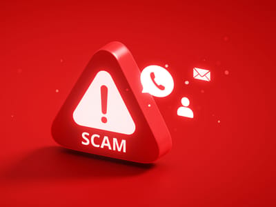 Red 3D warning triangle labeled SCAM with phone and email icons, stock scam illustration